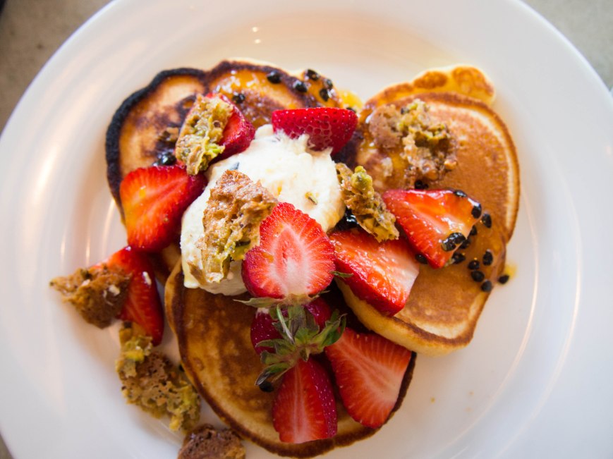 Lemon pancakes with passionfruit ricotta, strawberries and pistachio