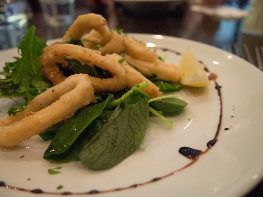 Calamari Fritti - Lightly pan fried calamari in olive oil, served with a lemon, garlic and parsley 